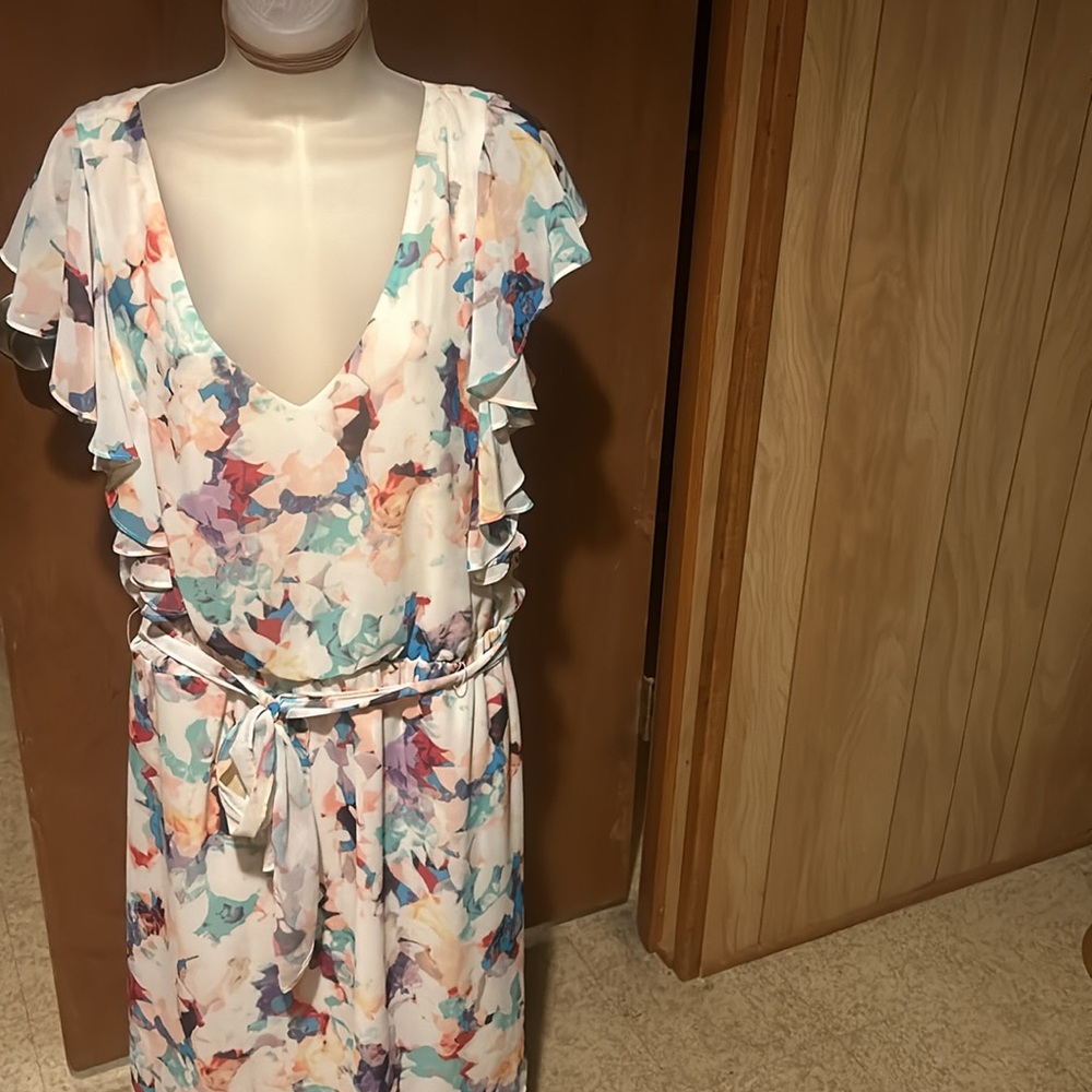 39 inches long 14 in across bust elastic waist with belt tie